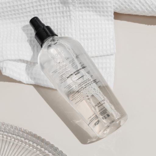Nutri-Hydrating Mist with glass and white towel - on cream bg-3000.jpg